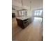 Large kitchen island with granite countertop and built-in microwave at 145 Dockside Dr # 396, Fayetteville, GA 30215