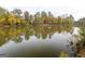 Serene lake view with colorful autumn trees reflected in the water at 145 Dockside Dr # 396, Fayetteville, GA 30215