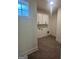 Laundry room with white cabinets and tiled floor at 145 Dockside Dr # 396, Fayetteville, GA 30215