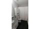 Clean bathroom with granite countertop, toilet, and shower at 2477 Briar Valley Way, Dacula, GA 30019