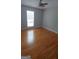 Hardwood floor bedroom with window and ceiling fan at 2477 Briar Valley Way, Dacula, GA 30019