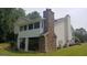 Two-story house with stone accents and a screened porch at 2477 Briar Valley Way, Dacula, GA 30019