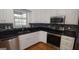 White cabinets and stainless steel appliances in this kitchen at 2477 Briar Valley Way, Dacula, GA 30019