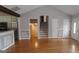 Hardwood floors, staircase, and kitchen views from the living room at 2477 Briar Valley Way, Dacula, GA 30019