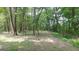 Open wooded area with dirt path at 2477 Briar Valley Way, Dacula, GA 30019