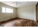 Bright bedroom with ceiling fan and large window at 2635 Luke Dr, Ellenwood, GA 30294