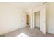 Bedroom with carpet, doors to bathroom and closet, and natural light at 177 Swindon Dr, Mcdonough, GA 30253
