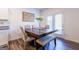Kitchen dining area with a wooden table and bench seating for four at 177 Swindon Dr, Mcdonough, GA 30253