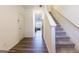 Bright entryway with hardwood floors and staircase leading upstairs at 177 Swindon Dr, Mcdonough, GA 30253