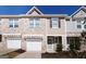 Brick front exterior of charming townhome with two-car garage at 177 Swindon Dr, Mcdonough, GA 30253