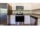 Modern kitchen with stainless steel appliances and granite countertops at 177 Swindon Dr, Mcdonough, GA 30253