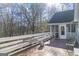 Enjoy outdoor dining on this spacious, wooden back deck overlooking the natural wooded area at 730 N Bethany Rd, Mcdonough, GA 30252