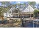 Sprawling backyard with covered carport and generous storage space beneath an elevated back porch at 730 N Bethany Rd, Mcdonough, GA 30252