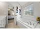 Bathroom with a garden tub and a view into a bedroom at 730 N Bethany Rd, Mcdonough, GA 30252