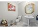 Bathroom with pedestal sink and octagonal mirror at 730 N Bethany Rd, Mcdonough, GA 30252