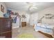 Charming bedroom with a twin bed, dresser, and built in shelves at 730 N Bethany Rd, Mcdonough, GA 30252