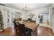Spacious dining room with hardwood floors, a view into the living room and kitchen at 730 N Bethany Rd, Mcdonough, GA 30252