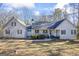 White two-story house with a wraparound porch and a large yard at 730 N Bethany Rd, Mcdonough, GA 30252