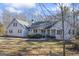 White house with a large yard and a swing set at 730 N Bethany Rd, Mcdonough, GA 30252