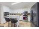 Modern kitchen with stainless steel appliances and breakfast bar at 730 N Bethany Rd, Mcdonough, GA 30252