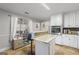 Updated kitchen with stainless steel appliances and an island at 730 N Bethany Rd, Mcdonough, GA 30252
