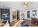 Bright home office features hardwood floors, French doors, and built-in shelving at 730 N Bethany Rd, Mcdonough, GA 30252