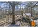 Whimsical backyard treehouse, promising endless outdoor adventures with a swing and covered patio below at 730 N Bethany Rd, Mcdonough, GA 30252