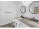 Double vanity bathroom with granite countertops and modern fixtures at 135 Kimbell Farm Dr, Locust Grove, GA 30248