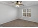 Charming bedroom with ceiling fan and large window at 135 Kimbell Farm Dr, Locust Grove, GA 30248