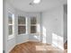 Breakfast nook with bay window and hardwood floors at 135 Kimbell Farm Dr, Locust Grove, GA 30248