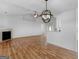 Bright dining room with hardwood floors and chandelier at 135 Kimbell Farm Dr, Locust Grove, GA 30248