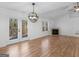 Open dining room with hardwood floors and fireplace at 135 Kimbell Farm Dr, Locust Grove, GA 30248