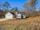 Ranch home with two car garage and landscaping at 135 Kimbell Farm Dr, Locust Grove, GA 30248