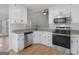 Kitchen with granite countertops and stainless steel appliances at 135 Kimbell Farm Dr, Locust Grove, GA 30248