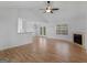 Bright living room with hardwood floors and fireplace at 135 Kimbell Farm Dr, Locust Grove, GA 30248