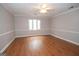 Spacious bedroom with hardwood floors and large window at 107 Rolling Green, Peachtree City, GA 30269