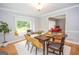 Dining room with hardwood floors, window seat, and table for six at 107 Rolling Green, Peachtree City, GA 30269