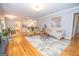 Open living room with hardwood floors and neutral color palette at 107 Rolling Green, Peachtree City, GA 30269