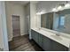 This bathroom features a double sink vanity, wood-look floors, and separate tub and shower at 2791 Riverchess Ct # 147, Atlanta, GA 30331