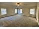 This bedroom features carpeted floors, neutral paint, ceiling fan and many windows with blinds at 2791 Riverchess Ct # 147, Atlanta, GA 30331