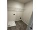 The laundry room features tile floors, neutral paint, and washer-dryer hookups at 2791 Riverchess Ct # 147, Atlanta, GA 30331