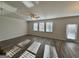 Open living room with wood-look floors, recessed lighting, and a door leading to the backyard at 2791 Riverchess Ct # 147, Atlanta, GA 30331