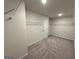 This is a large walk-in closet featuring carpet floors, white walls, and wire shelving at 2791 Riverchess Ct # 147, Atlanta, GA 30331