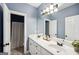 Bathroom with double vanity and light blue walls at 9435 Grande Dr, Winston, GA 30187