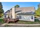 House back view, showcasing a deck and yard at 9435 Grande Dr, Winston, GA 30187