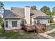 House back view, showcasing a deck and yard at 9435 Grande Dr, Winston, GA 30187