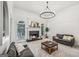 Spacious living room featuring a fireplace and large windows at 9435 Grande Dr, Winston, GA 30187