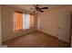 A well-lit bedroom featuring carpeted floors and neutral walls at 190 Wynfield Dr, Covington, GA 30016