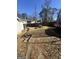 Spacious backyard featuring a picnic table, mature trees, and a fenced perimeter for privacy at 1344 Lynford Sw Dr, Atlanta, GA 30310