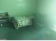 Cozy bedroom featuring a comfortable bed and furniture; ideal for relaxation at 1344 Lynford Sw Dr, Atlanta, GA 30310